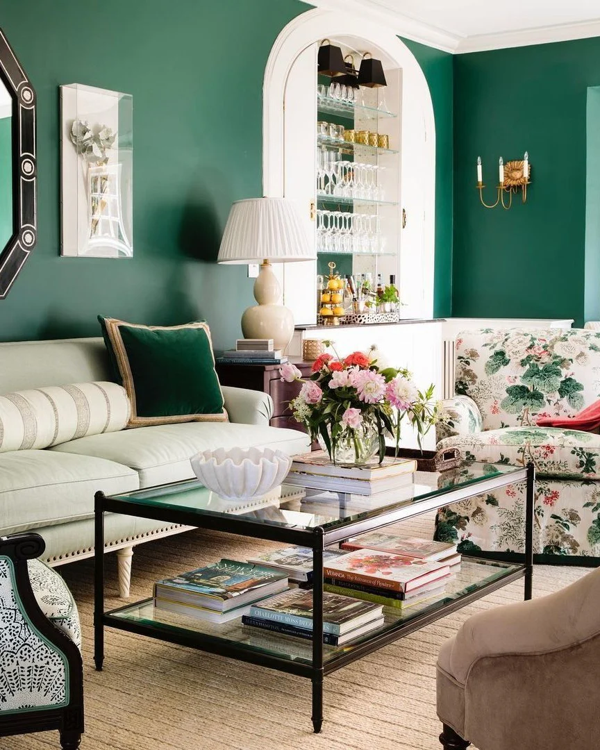 8. Emerald Wall Moment: Gold Lighting with Cream and Florals (Emerald Green and Gold Living Room Ideas)