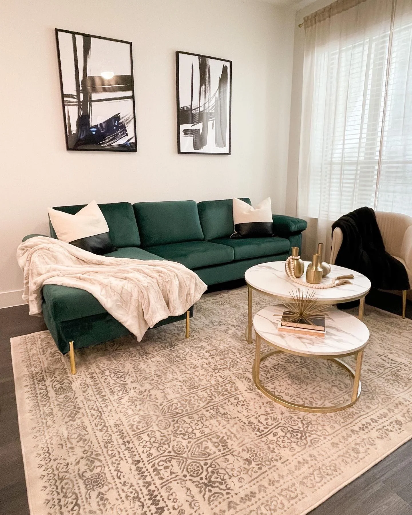 9. Soft Contemporary Chic: Emerald Sofa with Gold and Marble (Emerald Green and Gold Living Room Ideas)