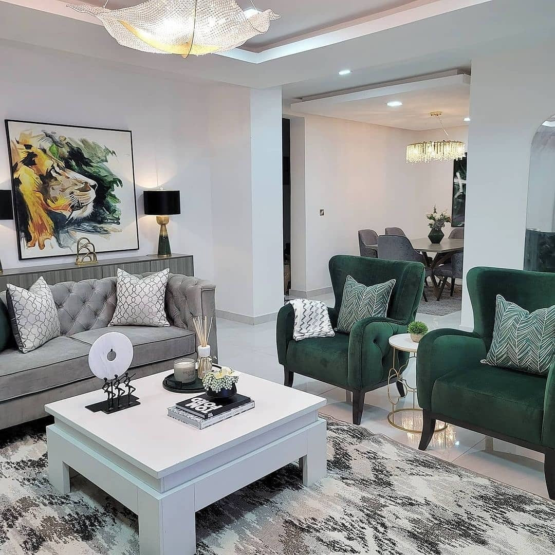 1. Soft Modern Glam: Emerald Accent Chairs with Gold & Ivory (Emerald Green and Gold Living Room Ideas)