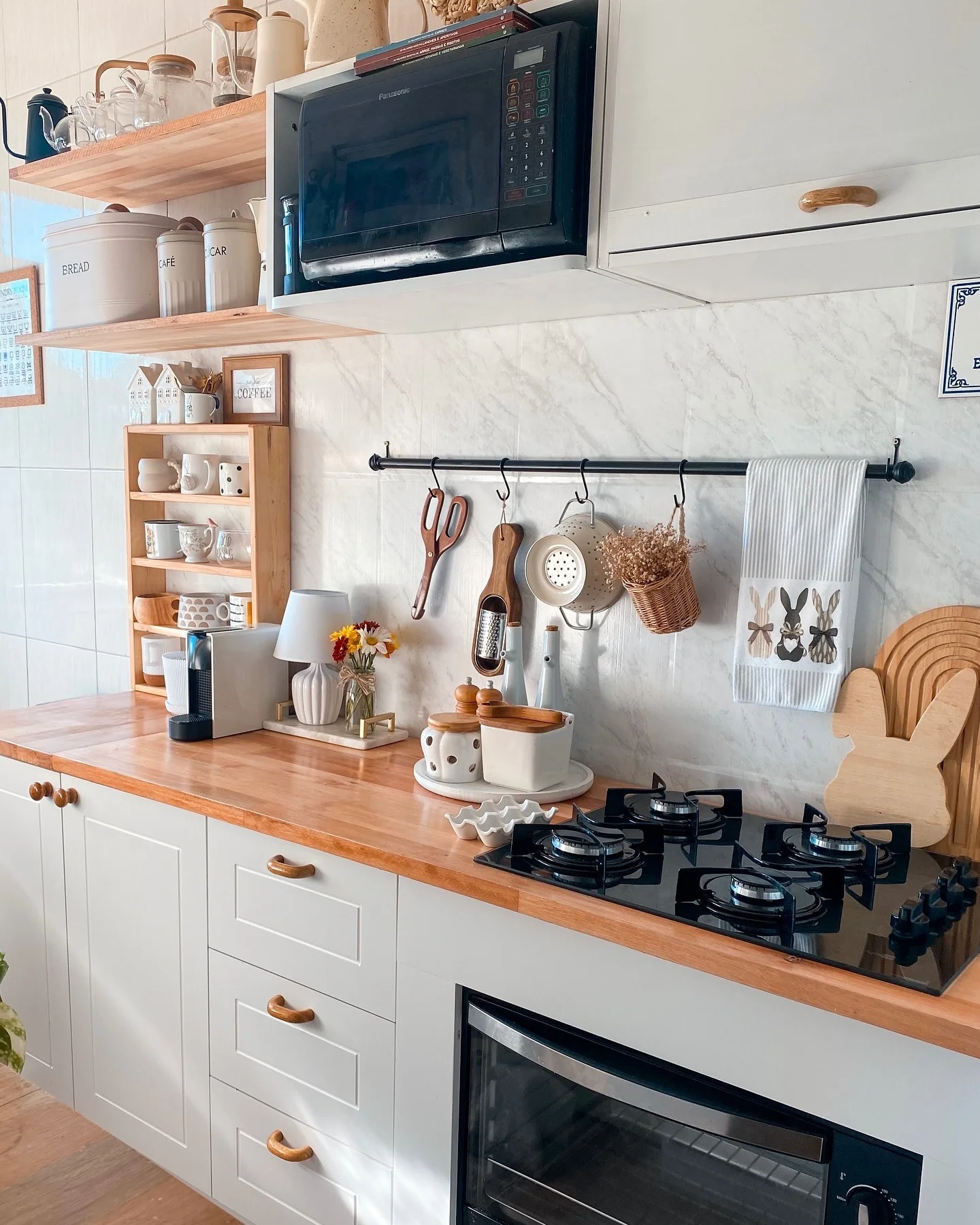 1. Warm Cottage Kitchen with Wooden Accents and Bunny Details (Small Cozy Kitchen Ideas)