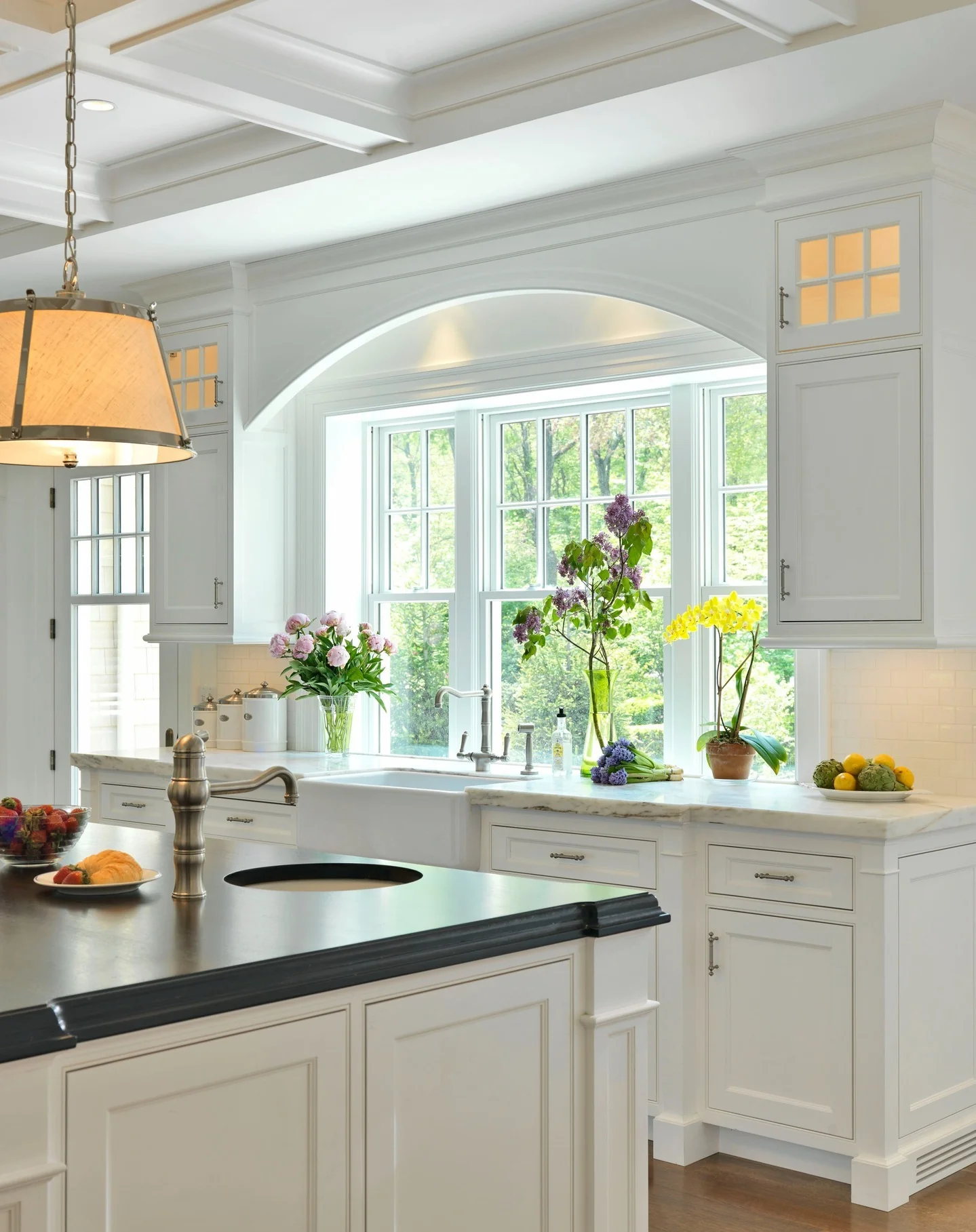 1. Classic White Elegance with Garden Views (Small White Kitchen Ideas)