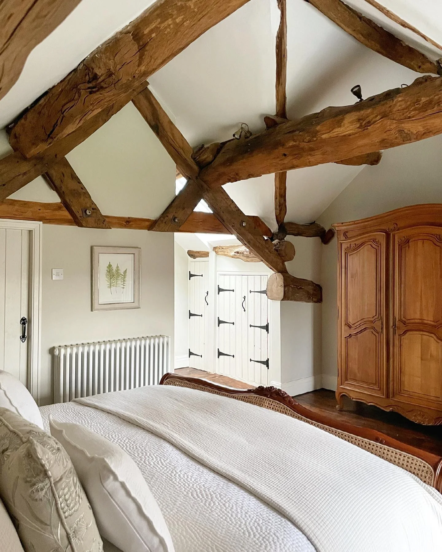 1. Rustic Roof-Beam Retreat in Warm Neutrals (Country Style Bedroom Ideas)