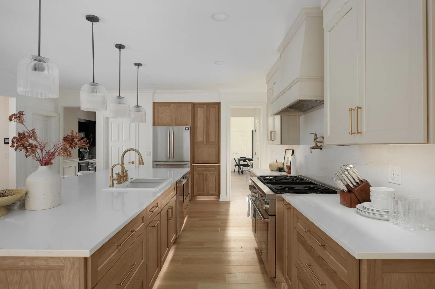 9. Rustic Maple Cabinet Wall with Mixed Metal Hardware + Warm Natural Floors (Maple Cabinet Kitchen Ideas)