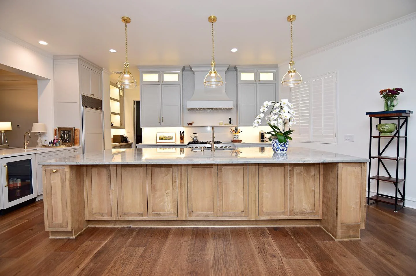 13. Transitional Maple Island Kitchen with Soft Gray Perimeter Cabinets + Brass Pendants (Maple Cabinet Kitchen Ideas)