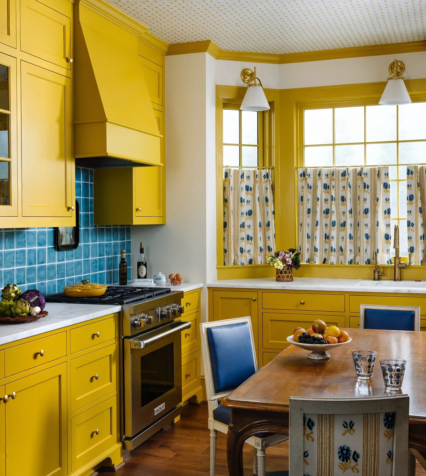 1. Classic Country Charm with Marigold and Blue Accents (Yellow Kitchen Ideas)