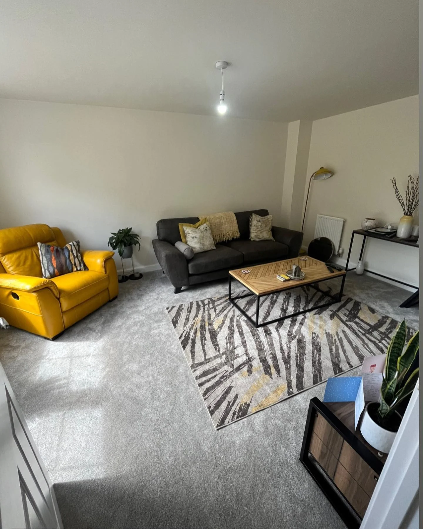 1. Mustard Accent Chair with Charcoal Sofa Balance (Yellow and Gray Living Room Ideas)