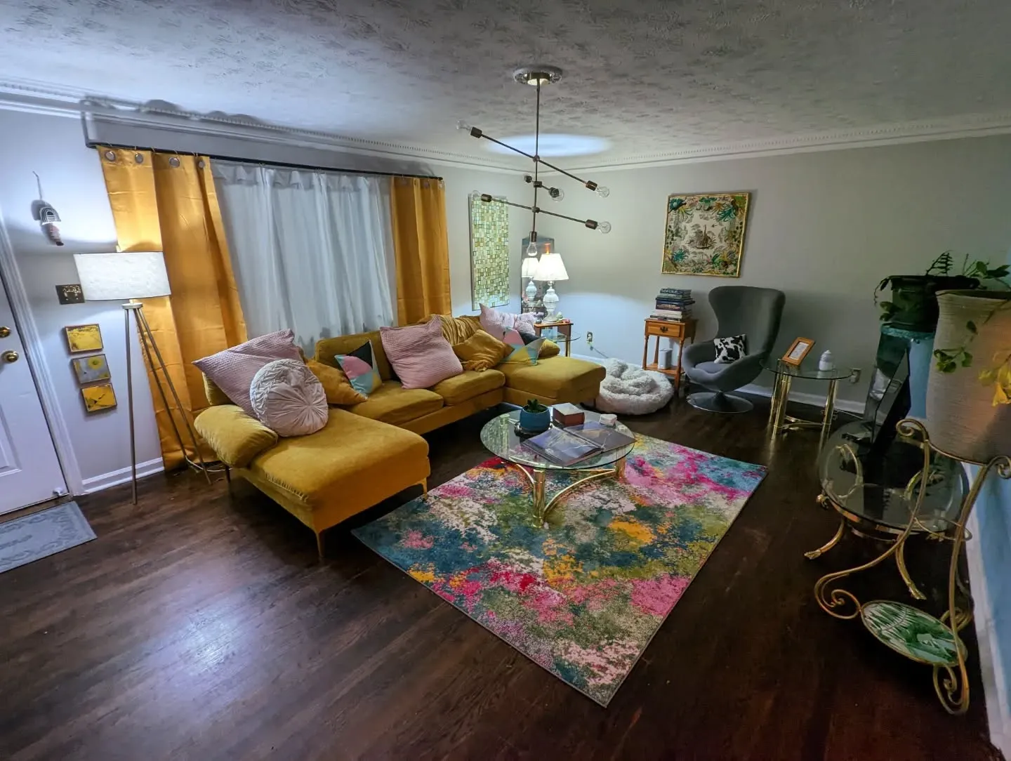 13. Mustard Sectional with Cool Gray Walls and Artistic Rug (Yellow and Gray Living Room Ideas)