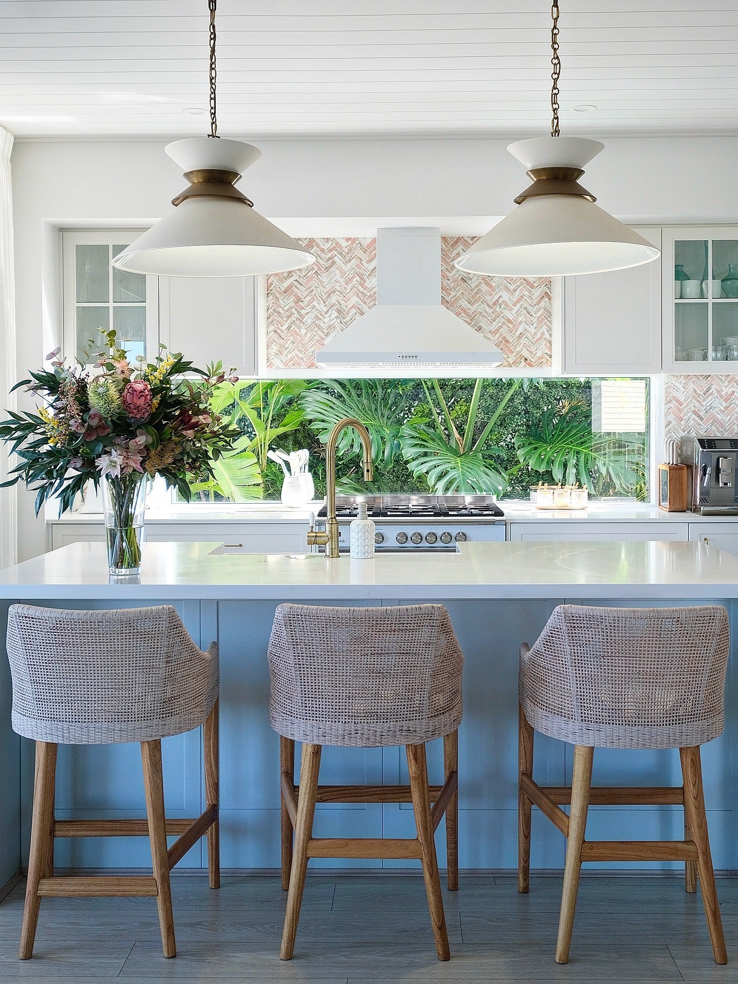 1. Soft Blue Island with Woven Counter Seating (Coastal Kitchen Ideas)