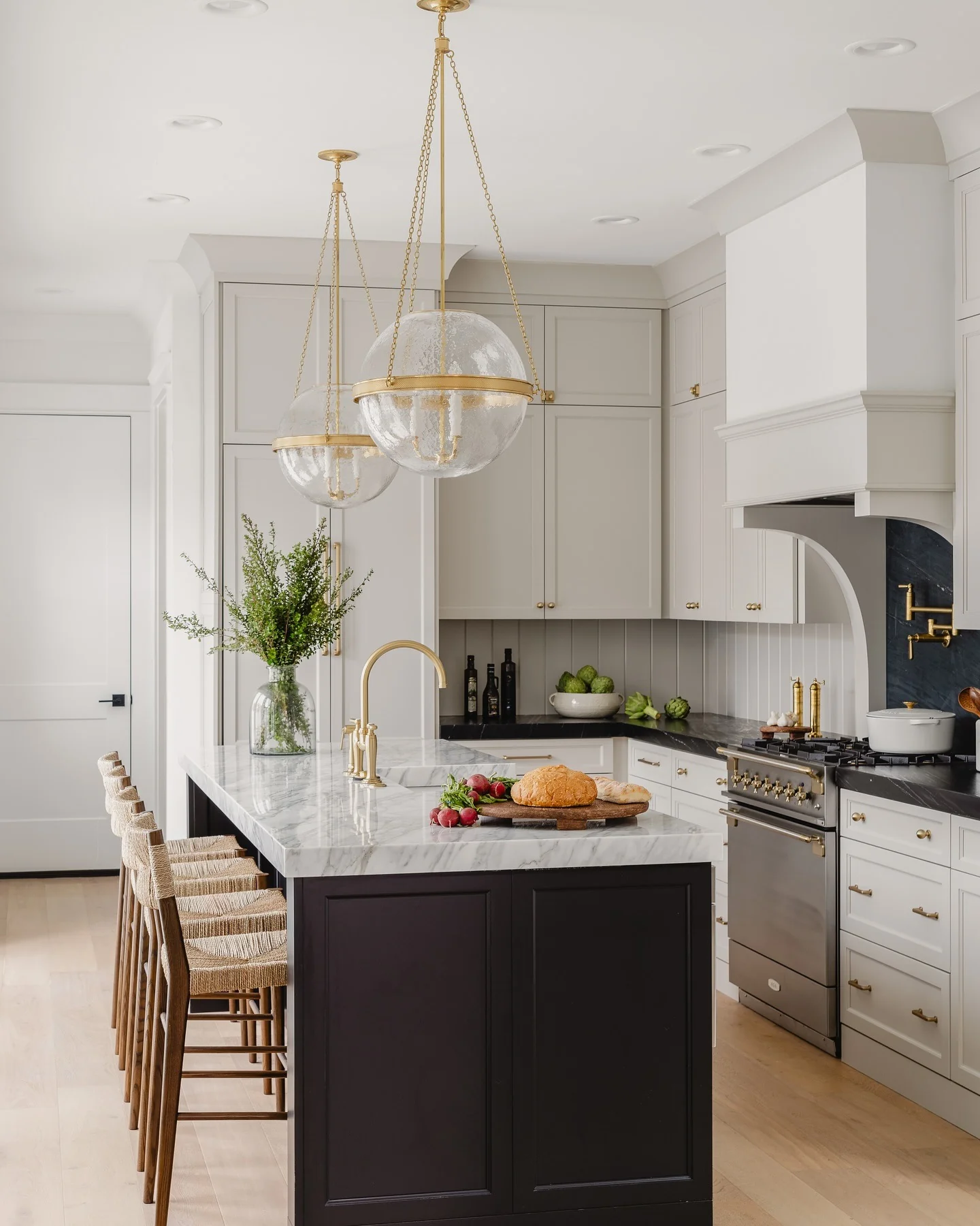13. Black and White Kitchen with Sculptural Lighting and Marble Surfaces (Gray and Black Kitchen Ideas)
