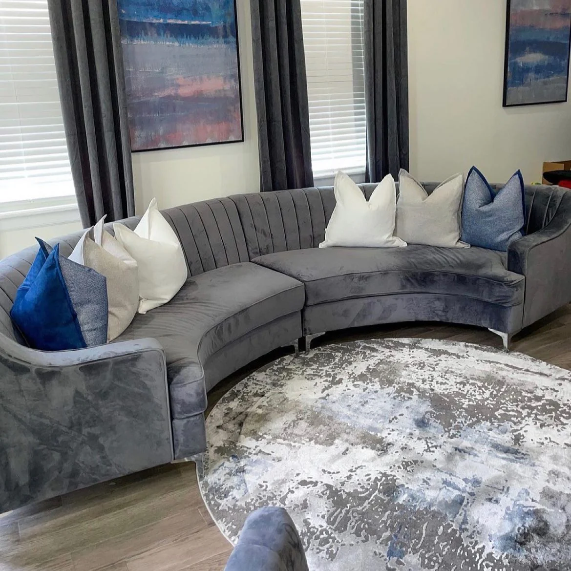 1. Curved Comfort in Charcoal and Soft White (Grey Sofa Living Room Ideas)