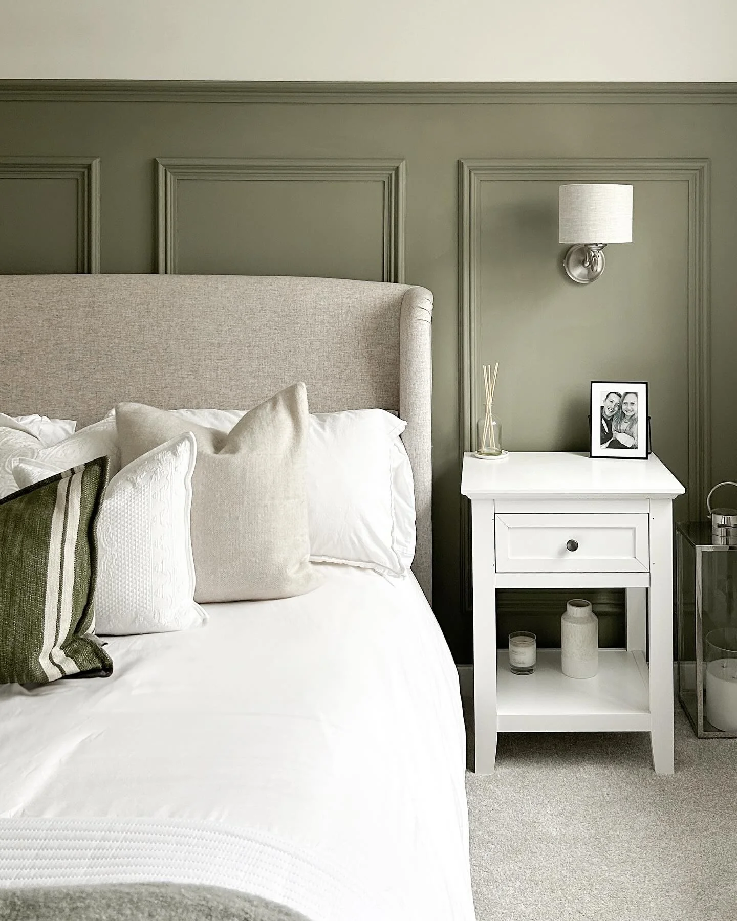 1. Timeless Contrast with Olive Paneling (Light Green Bedroom Ideas)