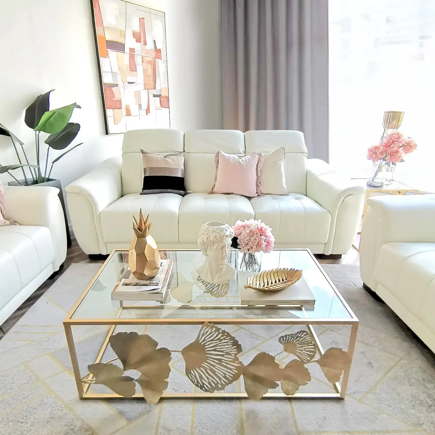 1. Soft Blush Elegance with Gold Accents (White and Gold Living Room Ideas)