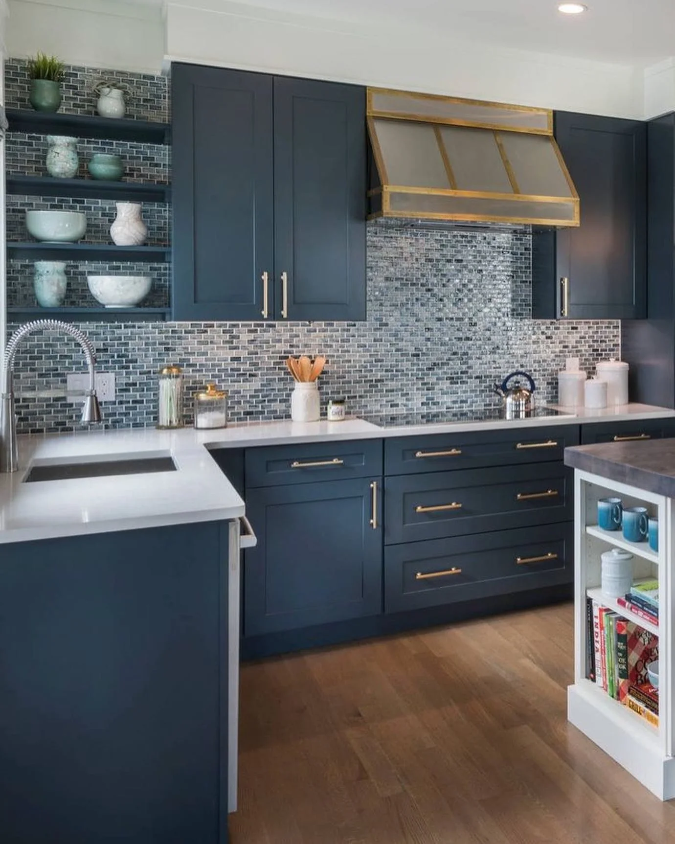 9. Navy Kitchen With Mosaic Tile Backsplash and Gold-Trim Range Hood (Navy Blue Kitchen Cabinets Ideas)