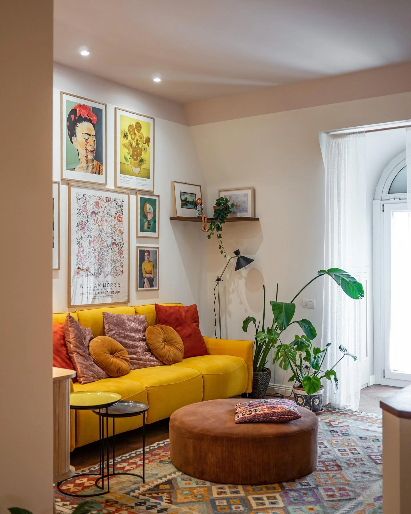 1. Eclectic Color Pop with Artistic Wall Gallery (Tiny Living Room Ideas)