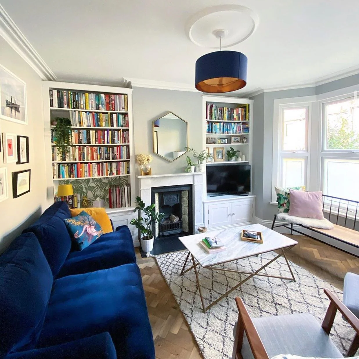 12. Built-In Library Style with Royal Blue + Soft Gray + Brass Accents (Royal Blue Sofa Living Room Ideas)