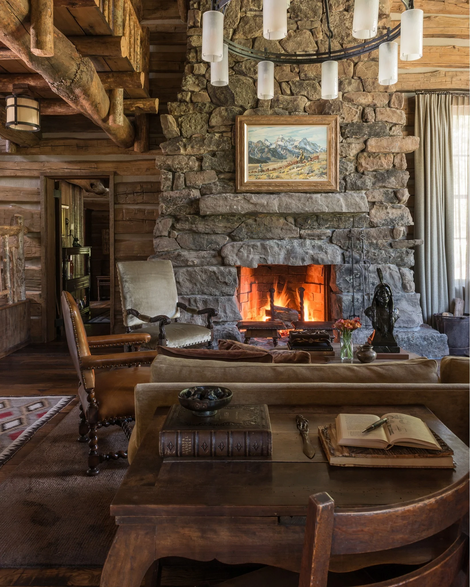 1. Warm Rustic Lodge with Rich Earth Tones (Stone Fireplace Living Room Ideas)