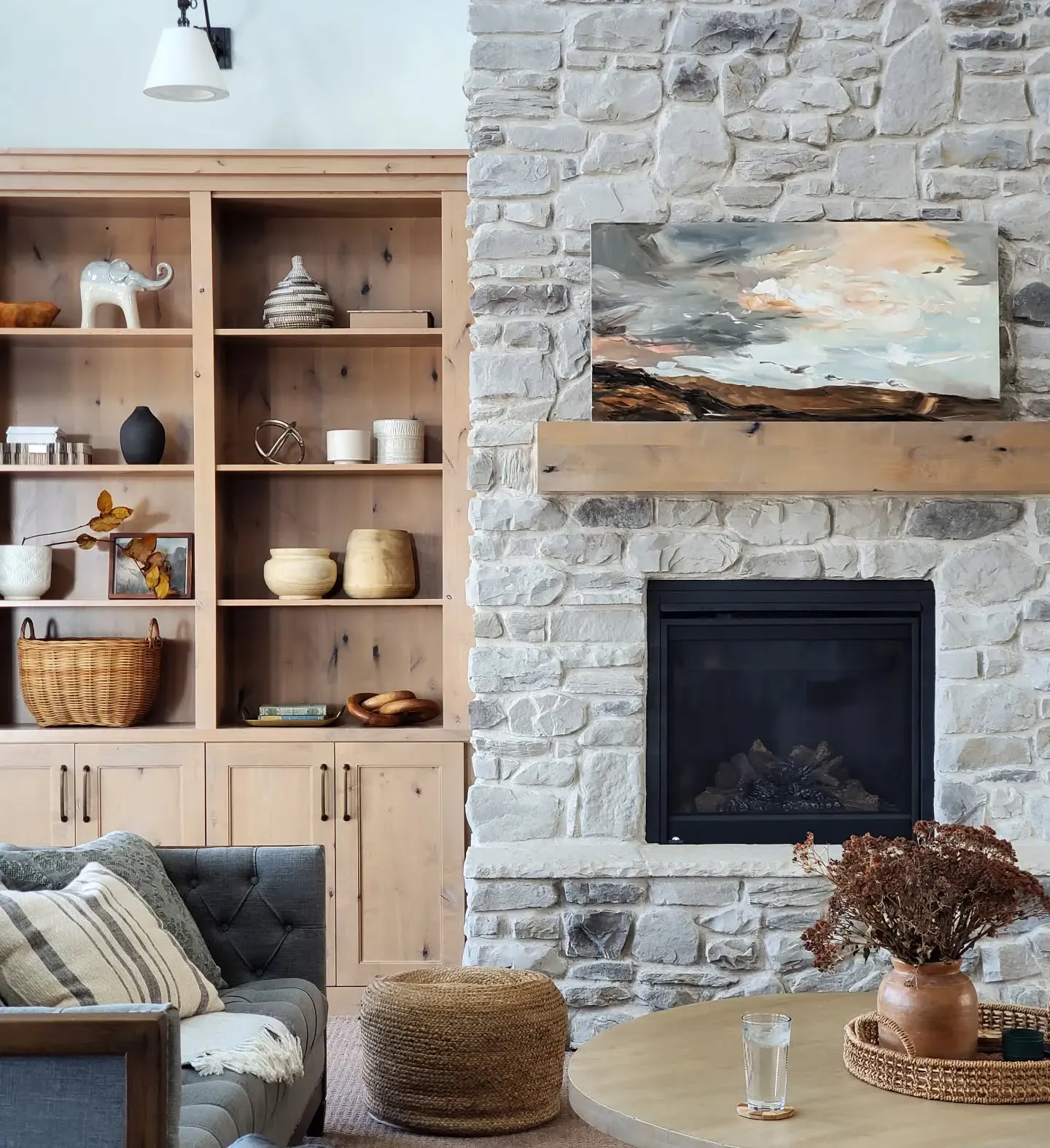 3. Soft Rustic Living Room with Pale Neutrals (Stone Fireplace Living Room Ideas)