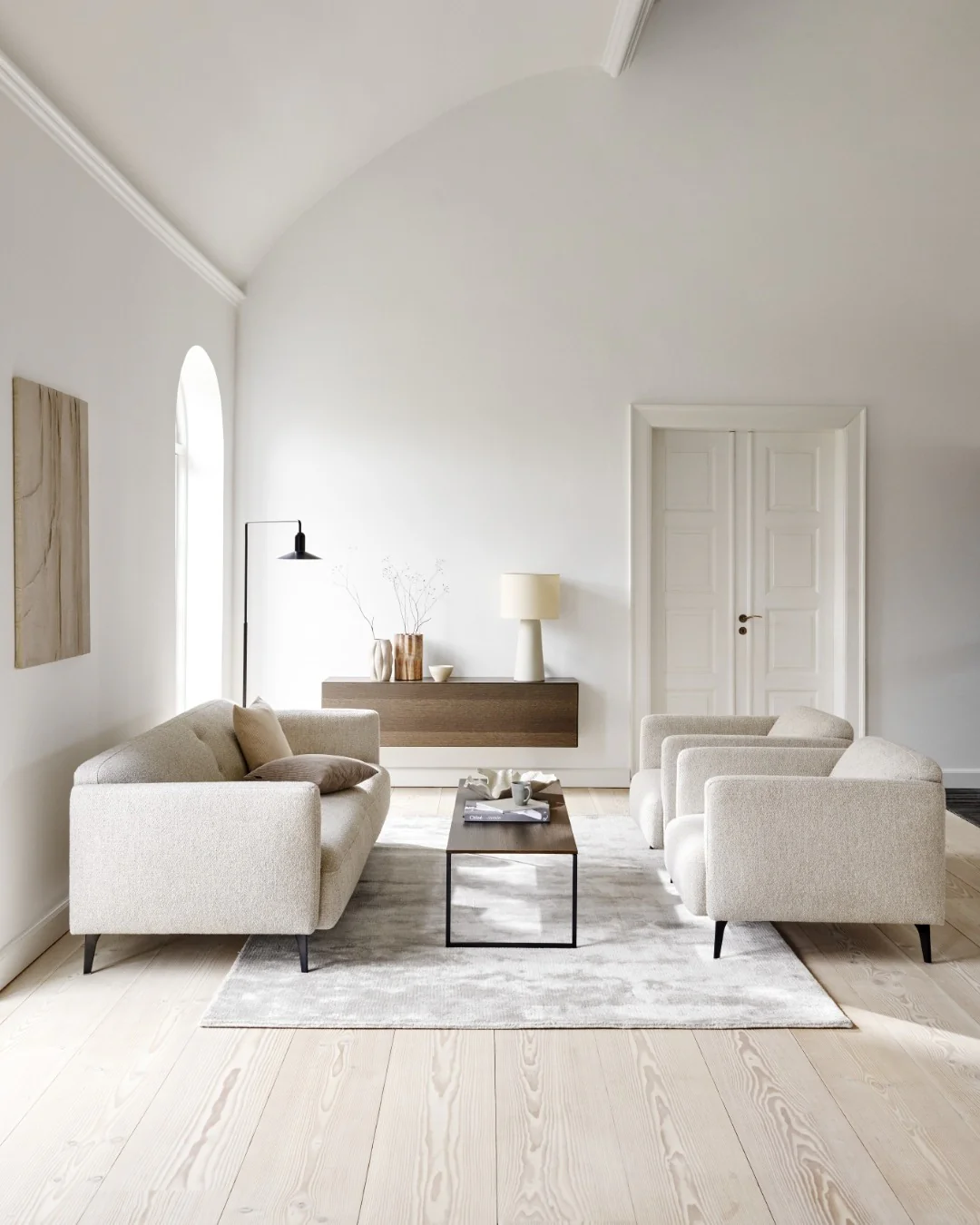 6. Pale Oak and Ivory Simplicity with Architectural Grace (Japandi Living Room Ideas)