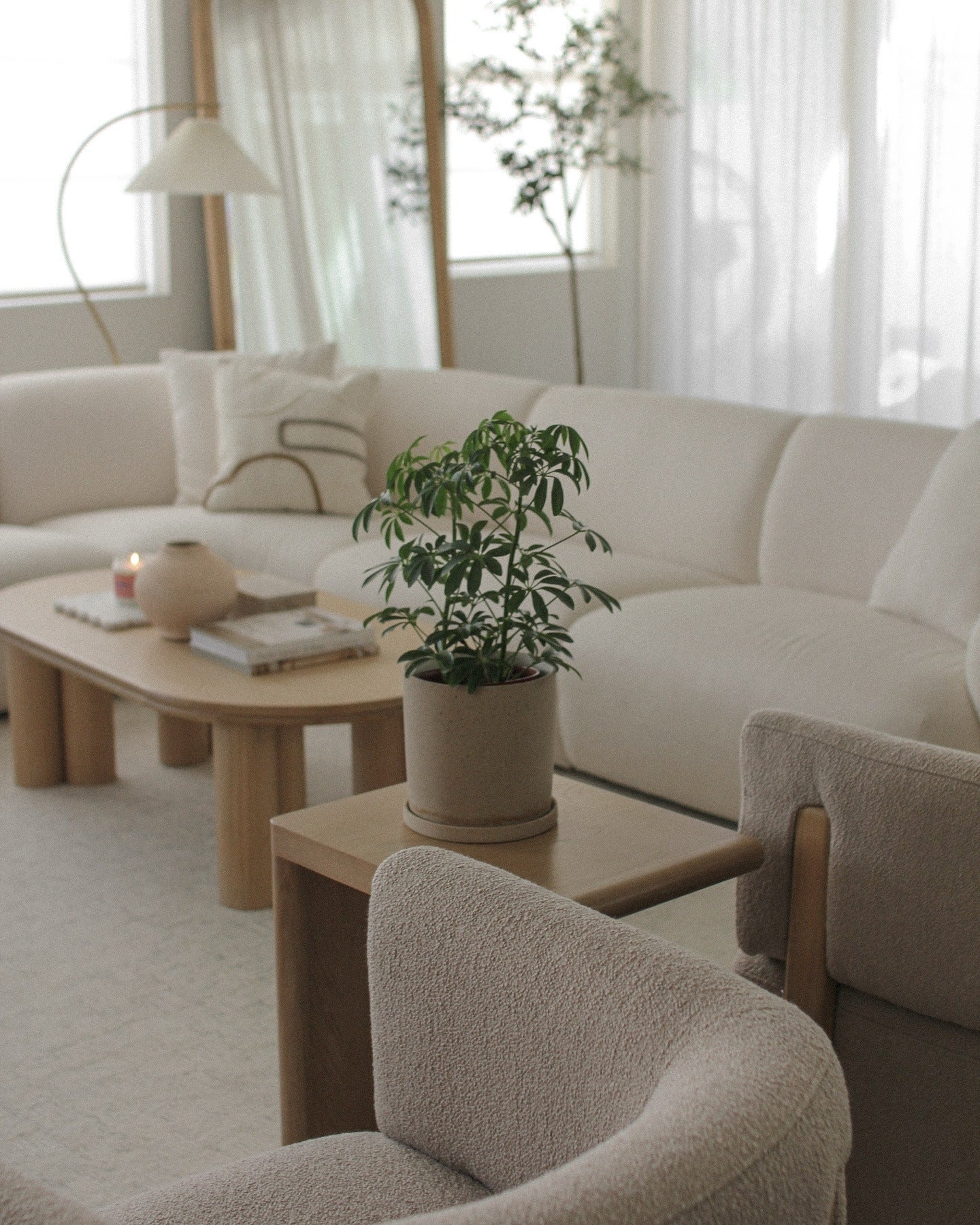 13. Soft Beige and Light Oak with Organic Greenery (Japandi Living Room Ideas)