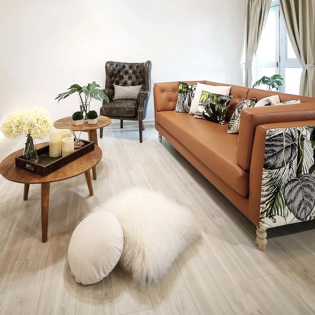 1. Botanical Modern with Warm Accents (Brown Leather Sofa Living Room Ideas)