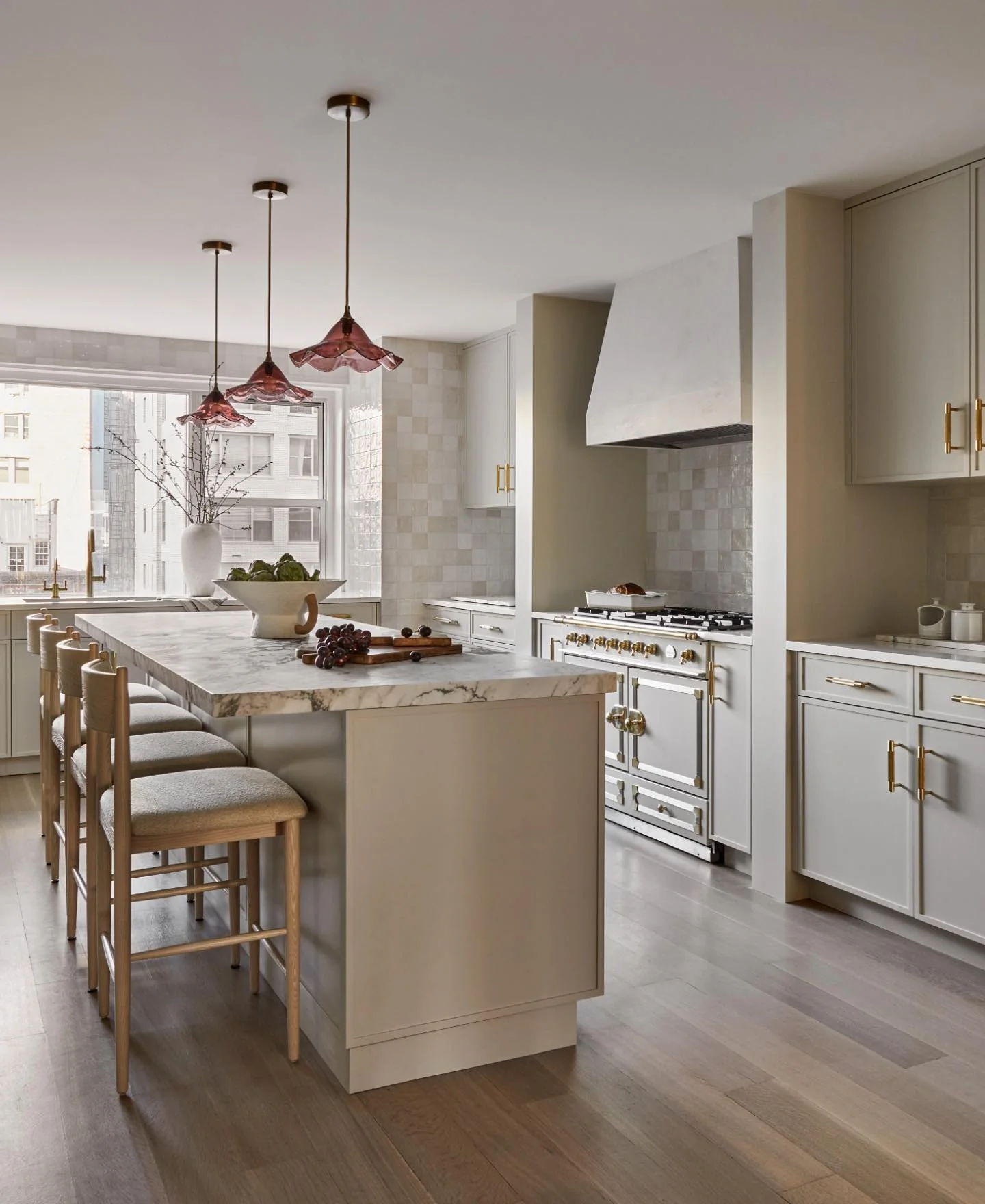 1. Soft Neutral Elegance with Sculptural Lighting (High Ceiling Kitchen Ideas)