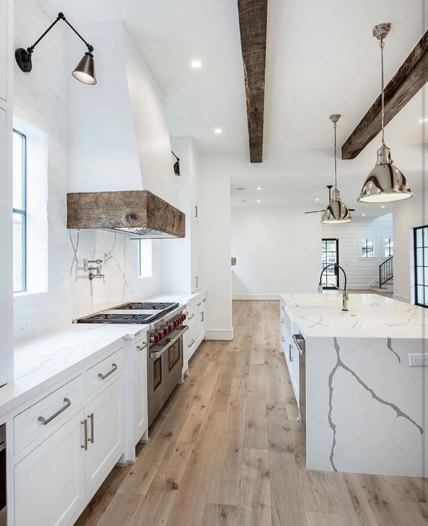 7. Minimal Farmhouse Metal Pendants with Bright White + Natural Oak Flooring (Farmhouse Kitchen Lighting Ideas)