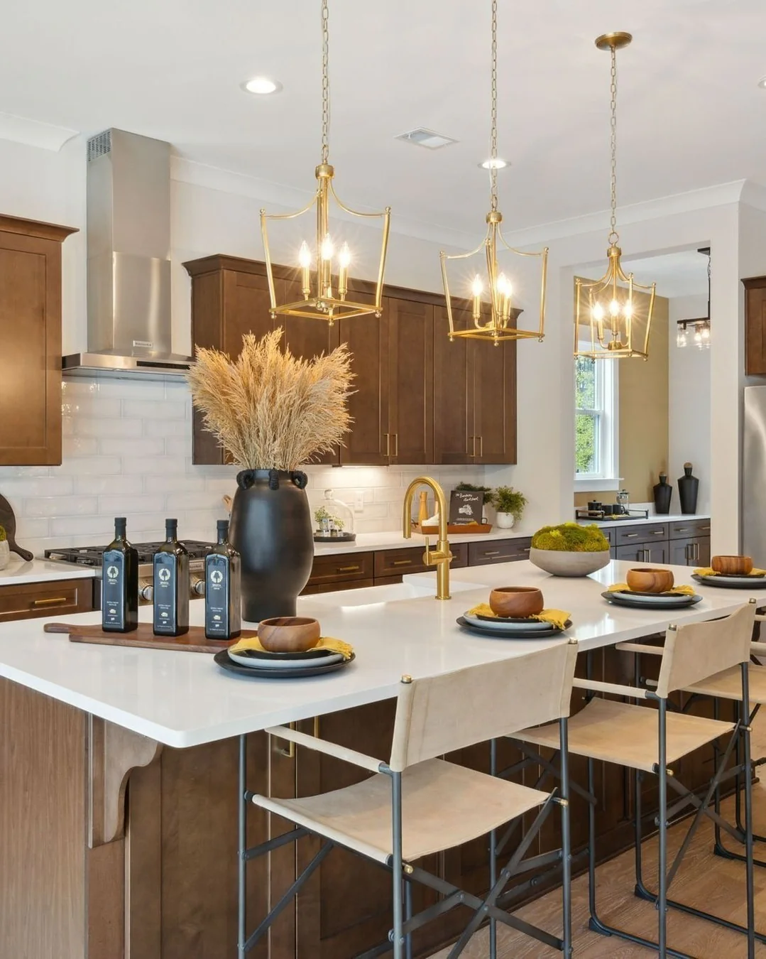 11. Warm Brass Lantern Pendants with Espresso Cabinets + Bright White Quartz (Farmhouse Kitchen Lighting Ideas)
