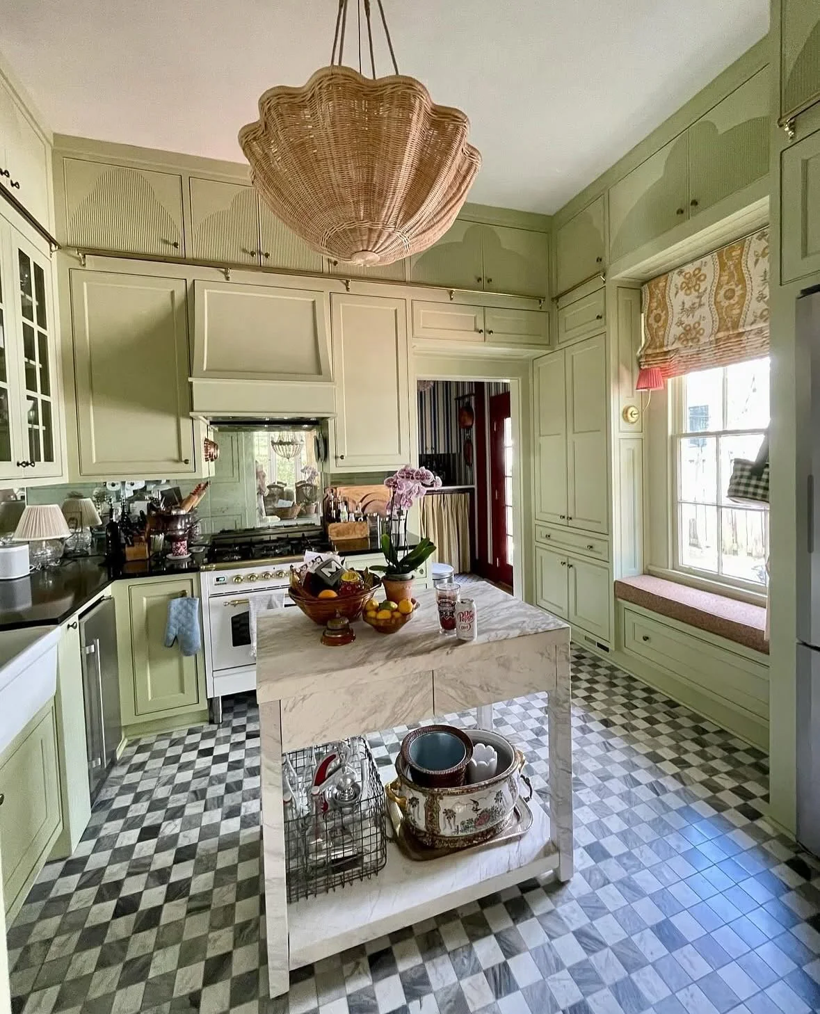 1. Vintage Charm with Olive Cabinetry and Mirrored Backdrop (Kitchen Window Ideas)
