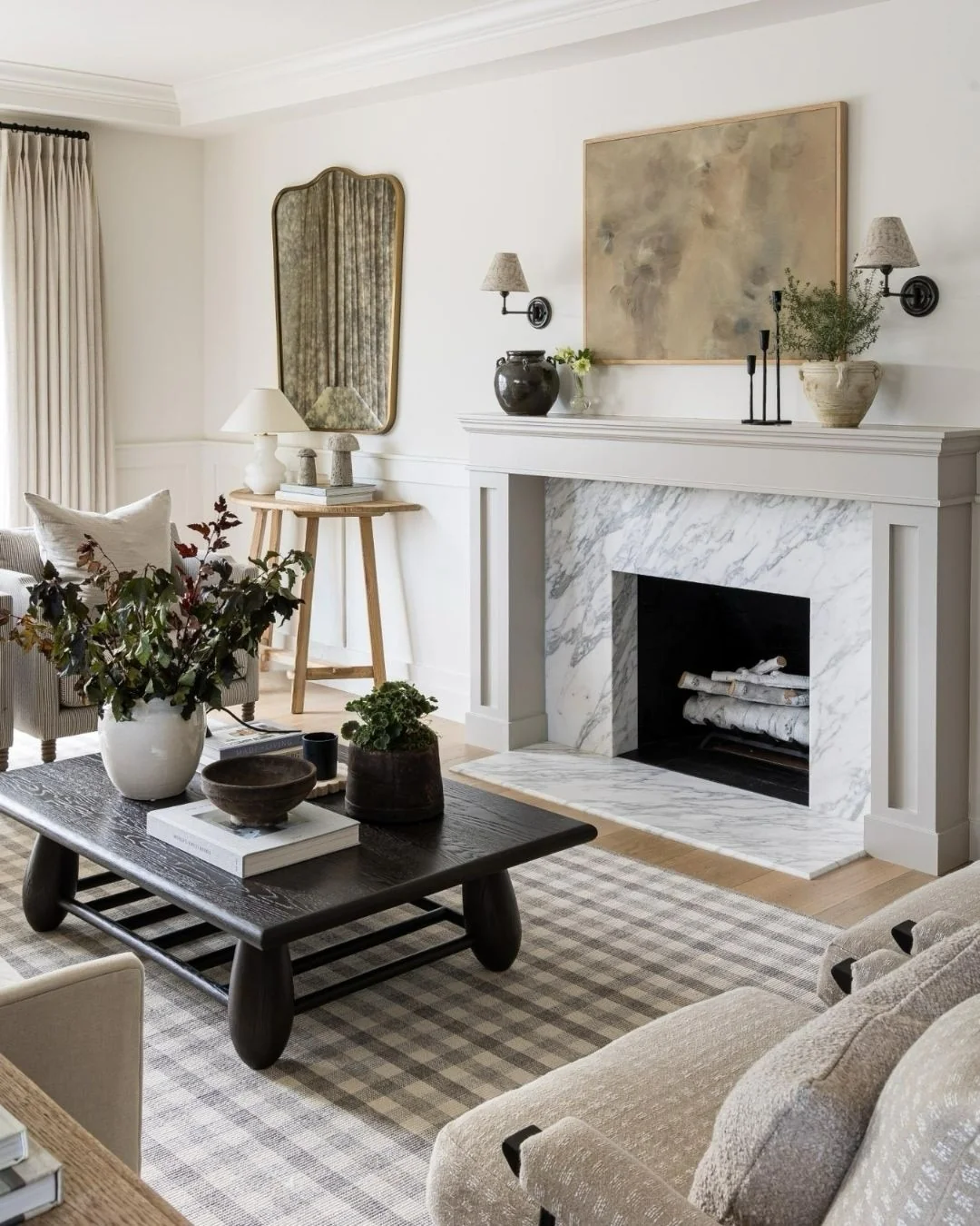 15. Marble Fireplace Moment with Cream, Black, and Warm Brown Styling (Cream and Brown Living Room Ideas)