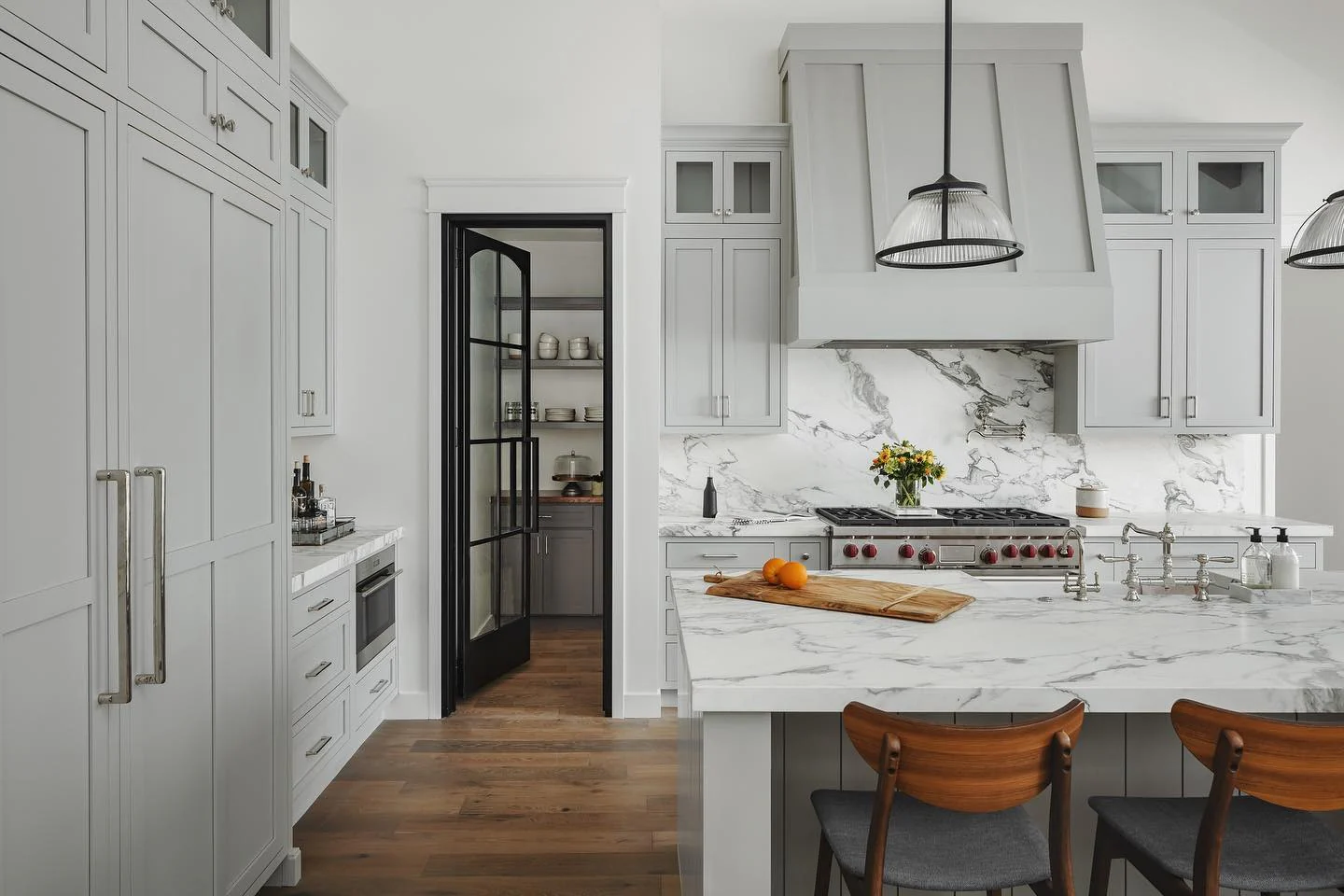3. Refined Light Grey Cabinetry with Marble Statement Backsplash (Light Grey Kitchen Cabinets Ideas)