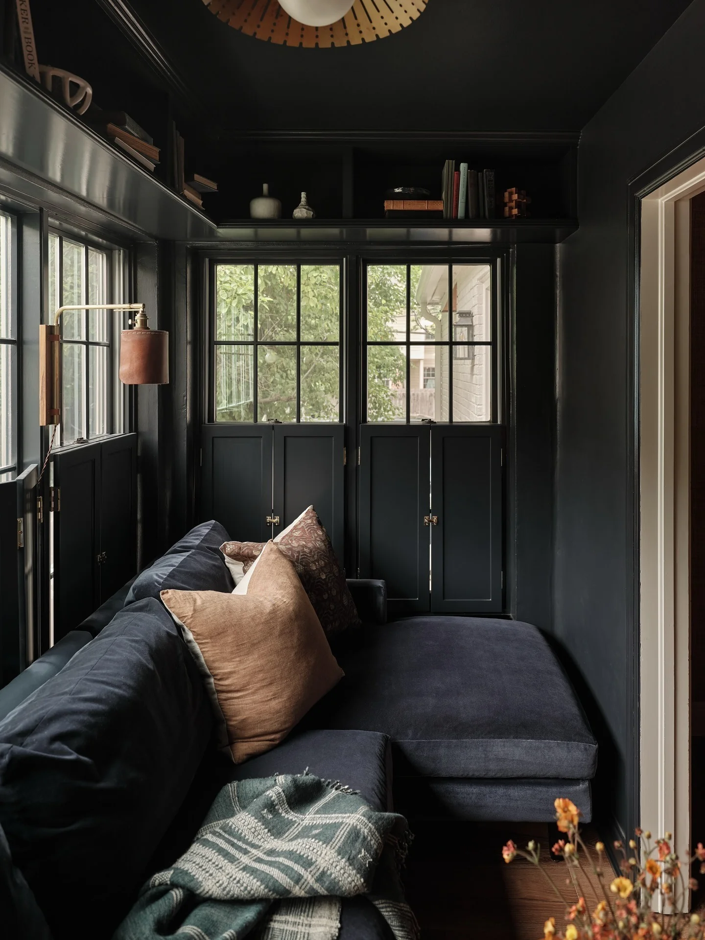 1. Moody Charcoal Lounge with Warm Camel Accents (Brown and Black Living Room Ideas)