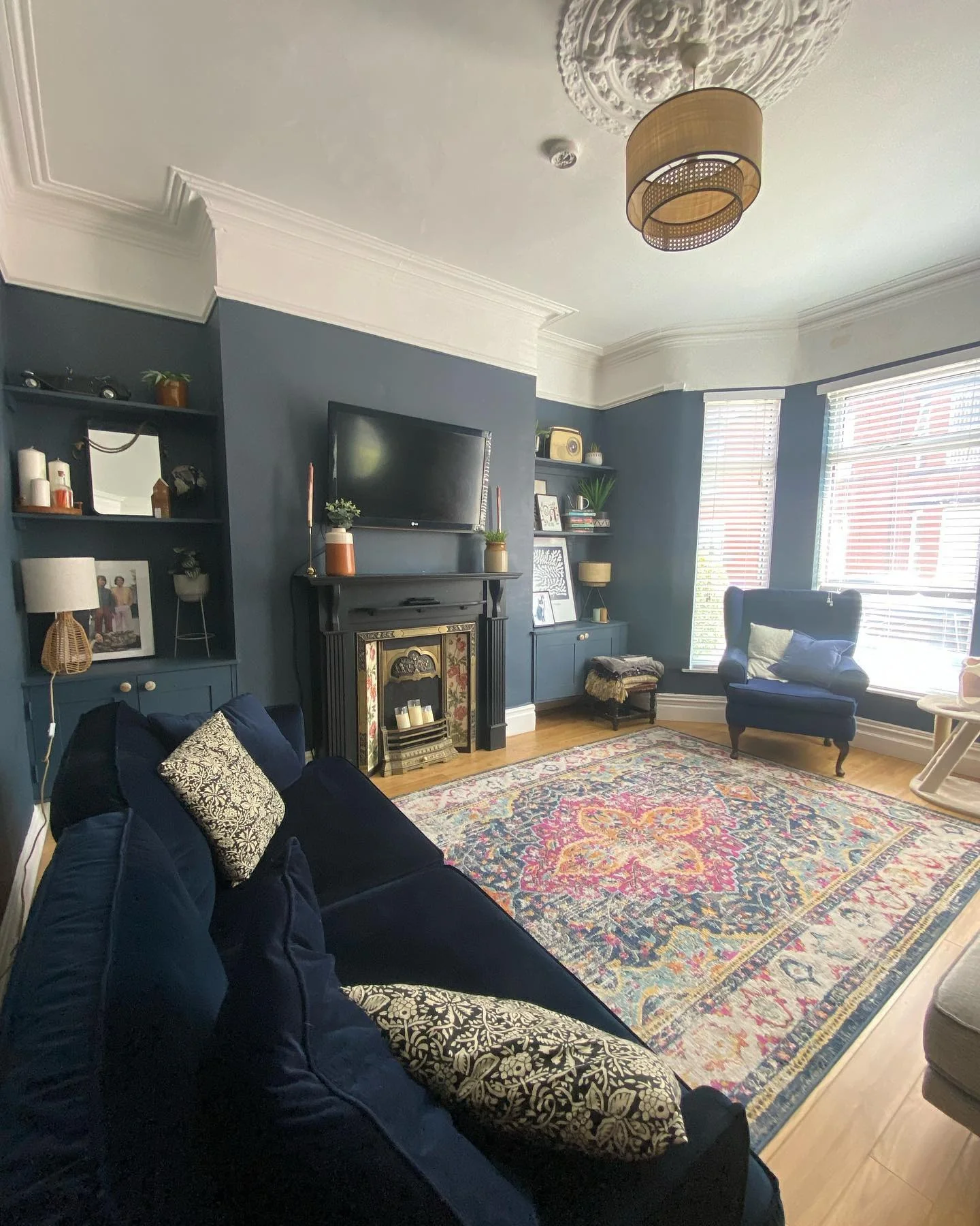 1. Deep Blue Elegance With Vintage Hearth (Victorian Living Room Ideas)